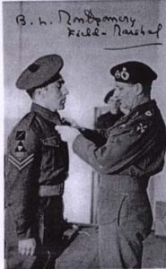 A picture of Corporal Harman receiving a medal 1944