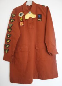 Photo of Brownie uniform with badges from 1980s