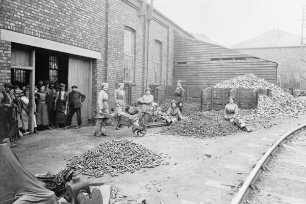 Collecting Old Rivets and Bolts for Reuse Photo of women workers collecting old rivets and bolts for reuse