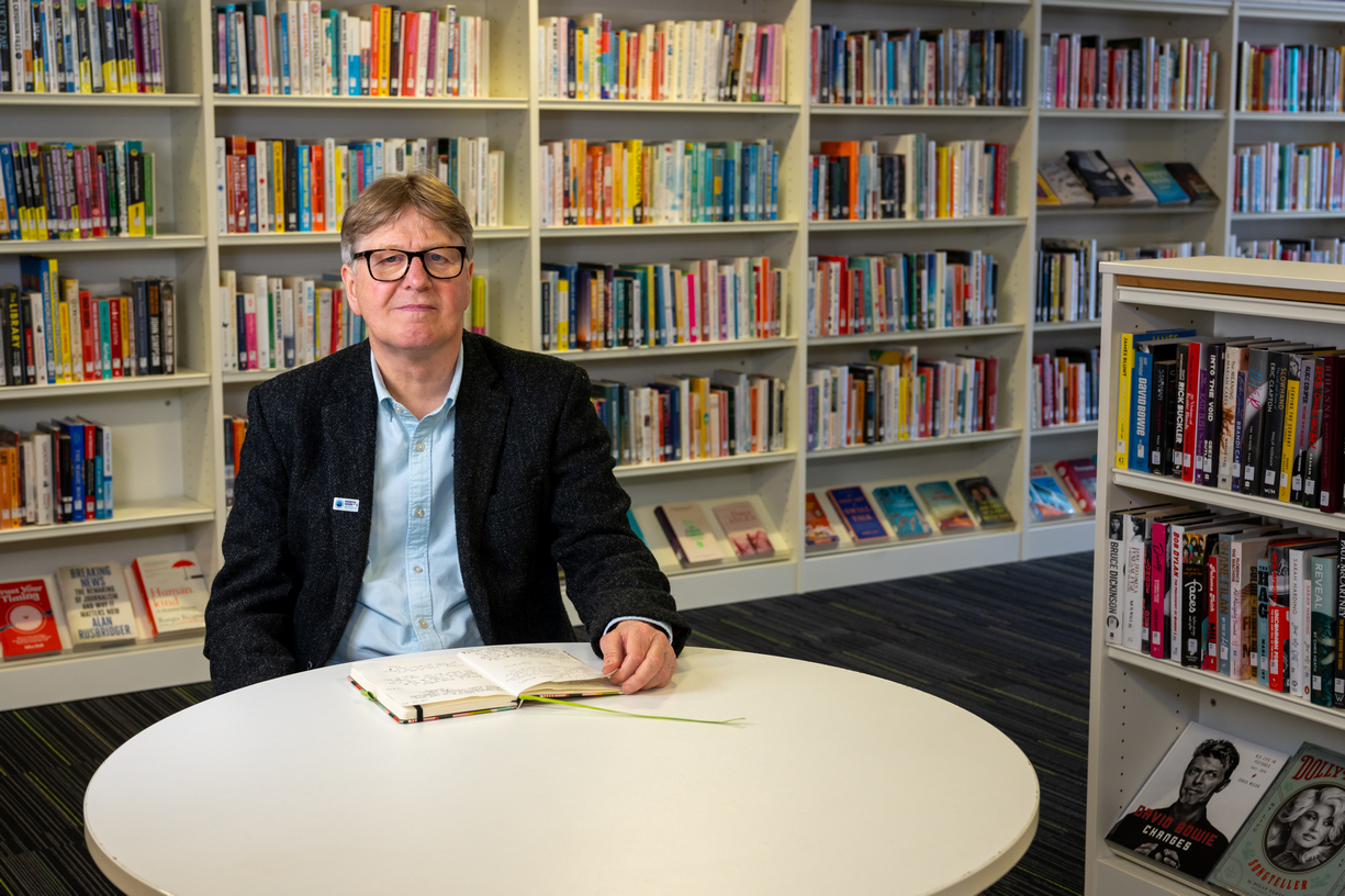 Photo of Dave Young sitting in North Shields Library