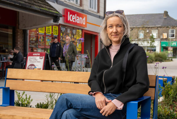 Photo of Ellie Patience on a bench in Bedford Street
