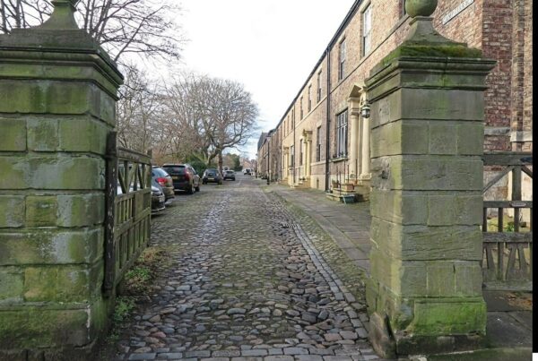 Photo of Camp Terrace looking through its stone gate posts